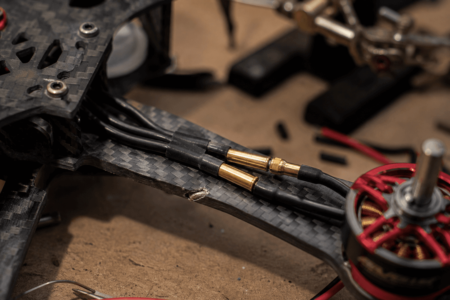 Motor wire routing and bullet connectors: Carbon cut hazard
